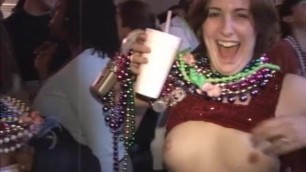 Girls expose breasts for beads at Mardi Gras