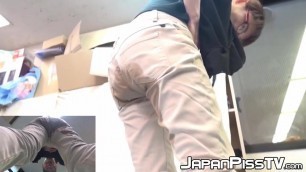 Japanese babe pisses while wearing her pants